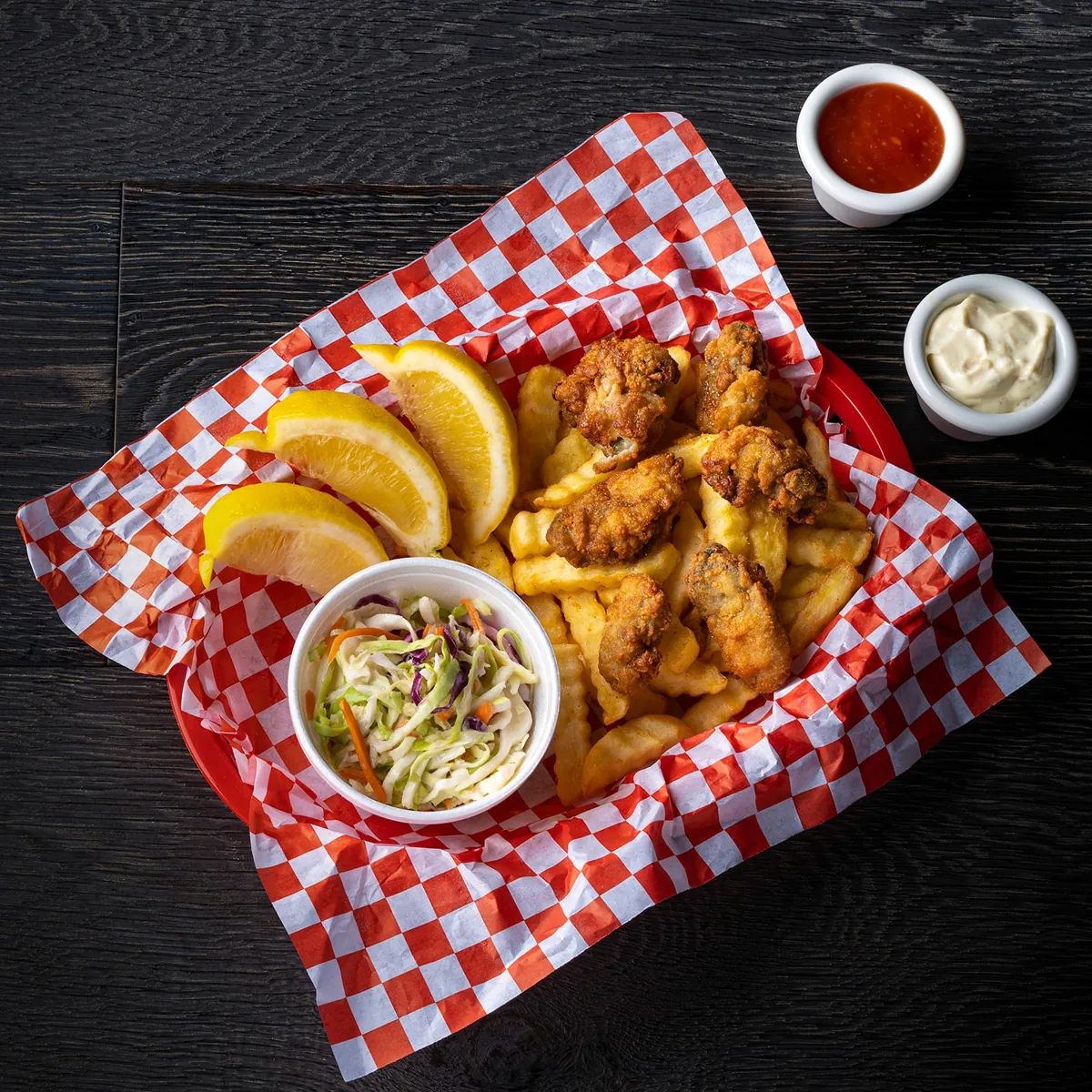 Fried chicken gizzards with fries, cole slaw and lemon