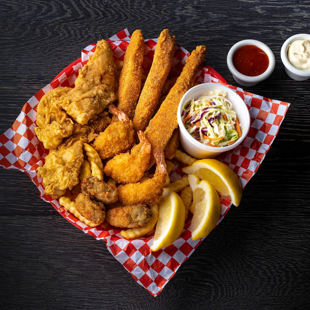 Seafood combo of catfish strips, fried shrimp and oysters with fries